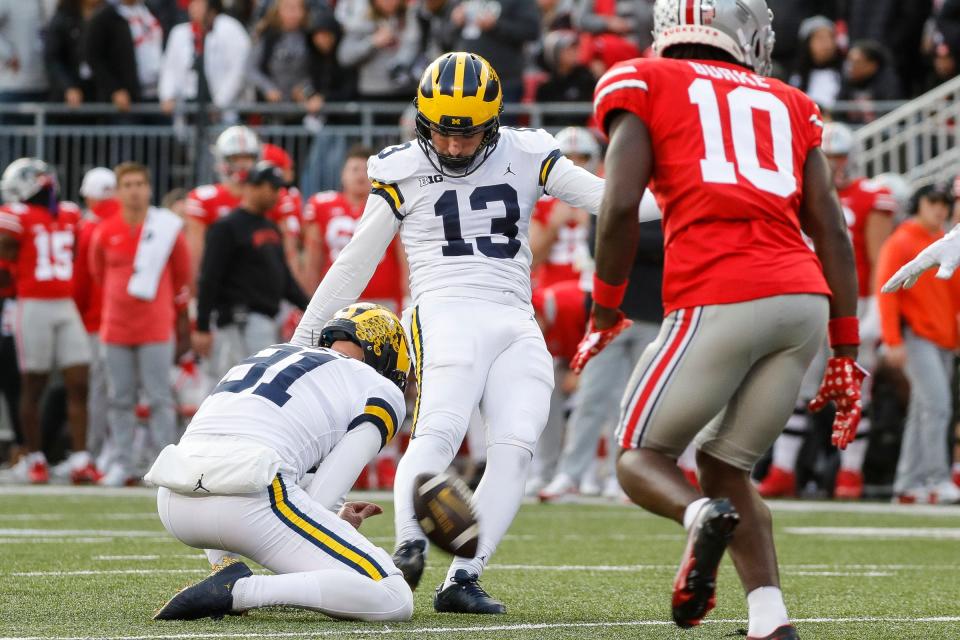 Michigan place kicker Jake Moody (13) attempts an extra point against Ohio State during the second half Nov. 26, 2022 at Ohio Stadium in Columbus.