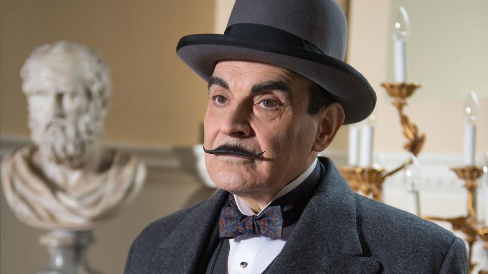 A still from Poirot shows the titular detective played by actor David Suchet
