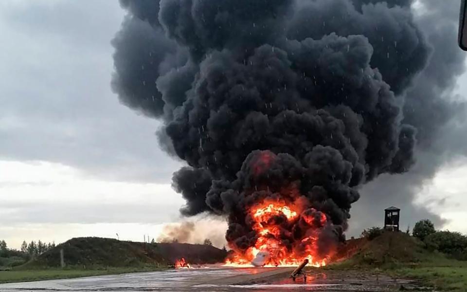 Russian Tupolev Tu-22 supersonic bomber engulfed in flames after reportedly being hit by a drone at Soltsy air base to the south of St Petersburg