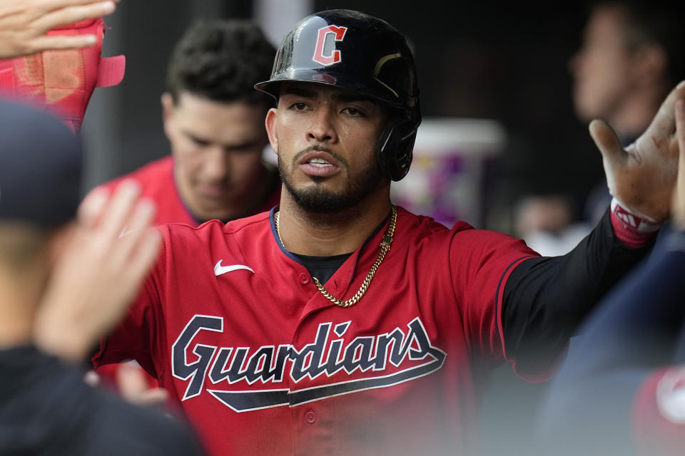 Cleveland Guardians' Gabriel Arias is congratulated in the dugout after scoring on a wild pitch in the second inning of a baseball game against the Chicago White Sox, Monday, May 22, 2023, in Cleveland. (AP Photo/Sue Ogrocki)