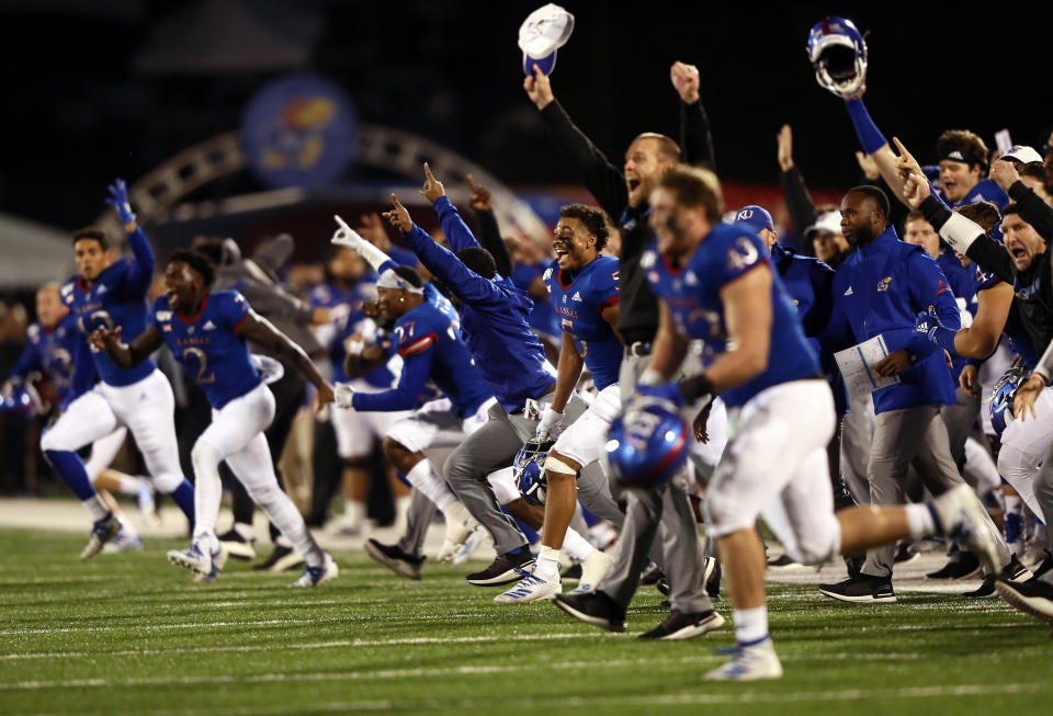 LAWRENCE, KANSAS - OCTOBER 26:  The Kansas Jayhawks storm the field and celebrate as they defeat the Texas Tech Red Raiders 37-34 to win the game at Memorial Stadium on October 26, 2019 in Lawrence, Kansas. (Photo by Jamie Squire/Getty Images)