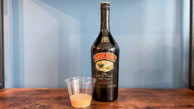 Bottle and tasting cup of Baileys