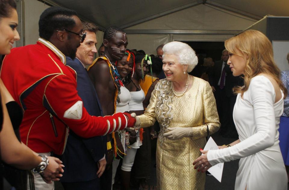 The Queen, with Kylie Minogue, meets will.i.am backstage at the Diamond Jubilee Concert at Buckingham Palace in 2012 (Dave Thompson/PA) (PA Archive)