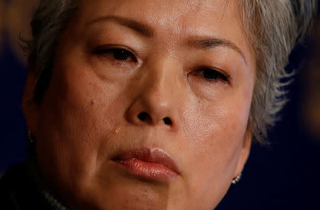 Noriko Matsumoto who fled with her children from Japan's Fukushima prefecture after the nuclear disaster, cries during a news conference in Tokyo, Japan, January 17, 2017. REUTERS/Kim Kyung-Hoon