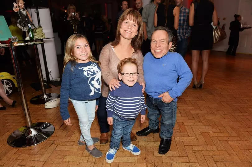 Warwick Davis and his family -Credit:Getty Images