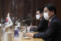 South Korea's Special Representative for Korean Peninsula Peace and Security Affairs Noh Kyu-duk, right, speaks during a trilateral meeting with Japanese Foreign Ministry's Director-General of the Asian and Oceanian Affairs Bureau Takehiro Funakoshi and U.S. Special Representative for North Korea Sung Kim on North Korea's issues at Foreign Ministry Tuesday, Sept. 14, 2021 n Tokyo. (AP Photo/Eugene Hoshiko)