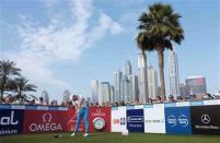 Rory McIlroy of Northern Ireland drives from the tee of the 1st hole during the first round of the 2014 Omega Dubai Desert Classic in Dubai January 30, 2014. REUTERS/Caren Firouz