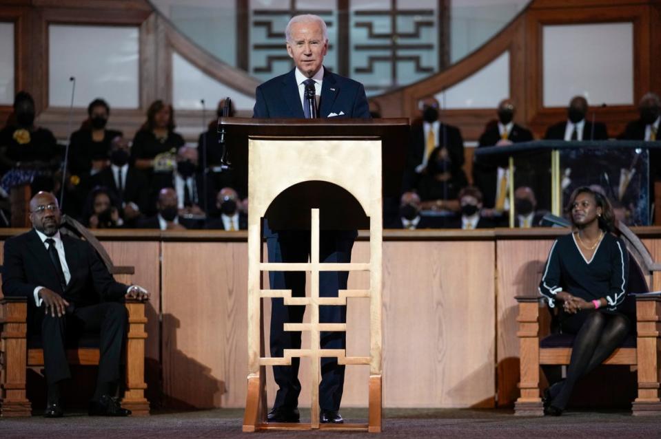 President Joe Biden, joined by Senator Raphael Warnock and Rev Chelsea D Waite, speaks at Ebenezer Baptist Church in Atlanta on 15 January (AP)