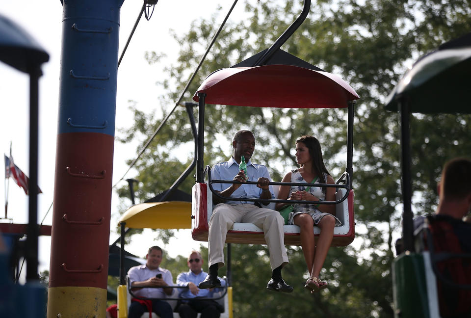 Ben Carson rides a chairlift with a reporter.