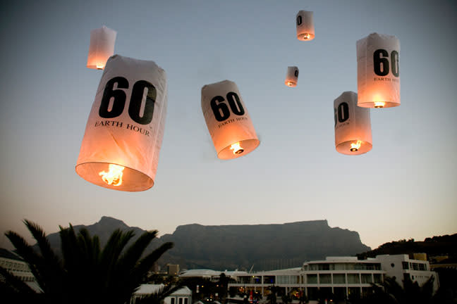 Seven lanterns released over the City of Cape Town, Republic of South Africa, (in front of Table Mountain) symbolizing the seven continents taking part in this global call to action on climate change to mark Earth Hour 2010. <br> <a href="http://www.worldwildlife.org/sites/earthhour/index.html" rel="nofollow noopener" target="_blank" data-ylk="slk:For more information about Earth Hour 2012, visit WWF.;elm:context_link;itc:0;sec:content-canvas" class="link ">For more information about Earth Hour 2012, visit WWF.</a>