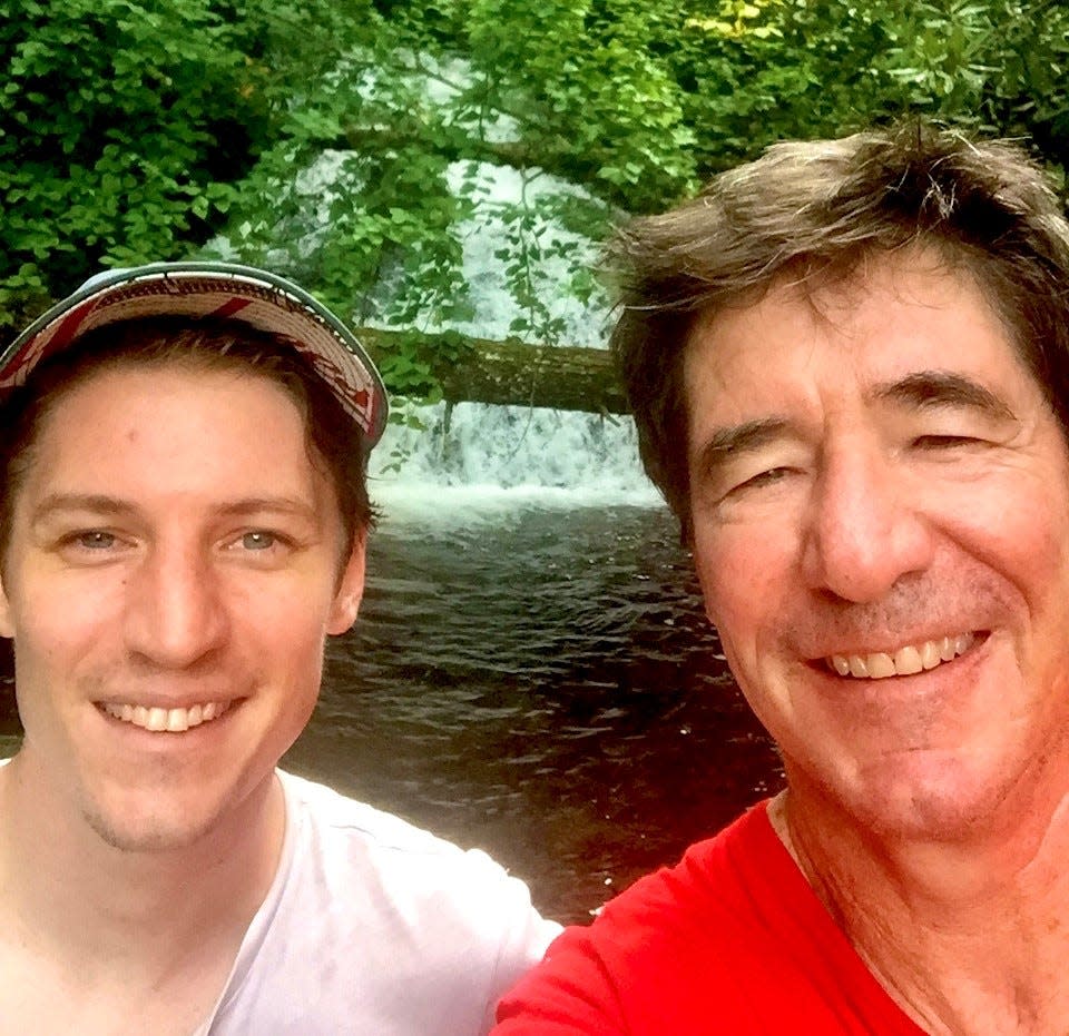 Enquirer sports columnist Paul Daugherty and his son, Kelly, at Crabtree Falls.