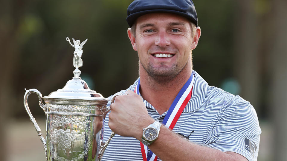 Bryson DeChambeau is pictured holding the trophy after winning the 2020 US Open.