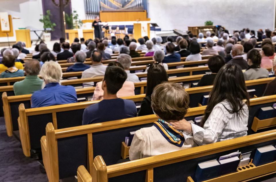 Parishioners and members of the Taiwanese community attend the one-year anniversary memorial service.