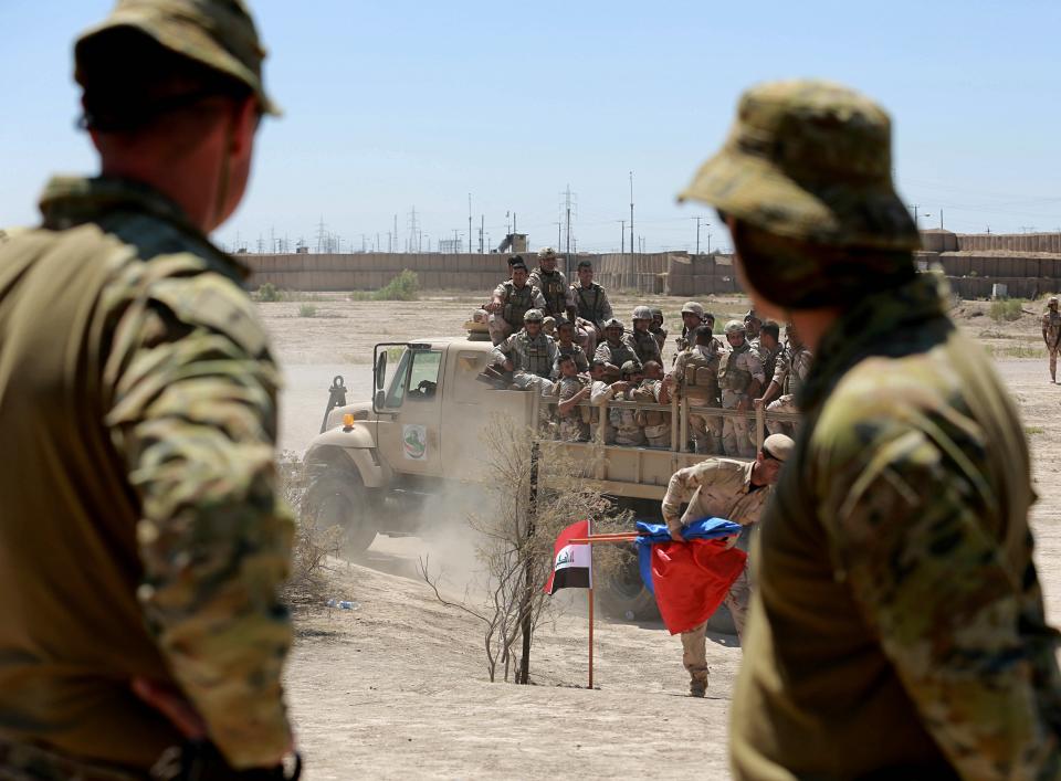 Australian and New Zealand coalition forces participate in a training mission with Iraqi army soldiers at Taji Base, north of Baghdad, Iraq, Wednesday, April 17, 2019. A month after the defeat of the Islamic State group in Syria and Iraq, the U.S.-led international coalition has turned its attention to training Iraqi forces to secure the country against lingering threats posed by IS cells operating in the countryside. (AP Photo/Hadi Mizban)