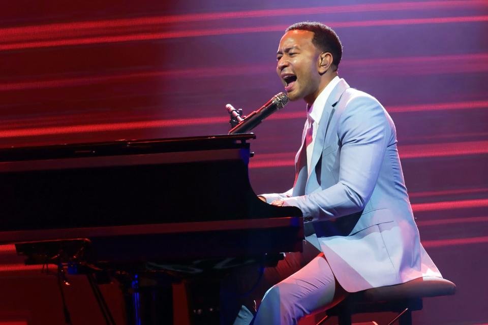 John Legend shows off his skills during a performance in Paris on Thursday.