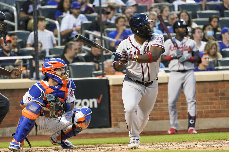 Atlanta Braves' Abraham Almonte watches his two-run home run during the third inning of the team's baseball game against the New York Mets, Tuesday, July 27, 2021, in New York. (AP Photo/Mary Altaffer)