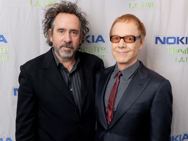 <p>Kevin Winter/Getty</p> Tim Burton and composer Danny Elfman in 2013