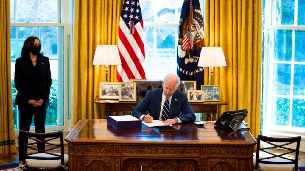 U.S. President Joe Biden participates in a bill signing as Vice President Kamala Harris looks on in the Oval Office of the White House on March 11, 2021 in Washington, DC. (Photo by Doug Mills-Pool/Getty Images)