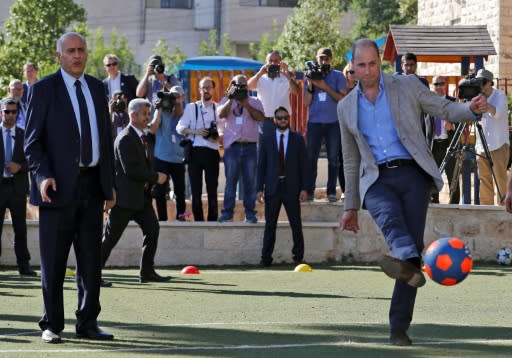 In the occupied West Bank city of Ramallah, Britain's Prince William drank coffee and sampled some traditional Palestinian food before watching and briefly joining in football with Palestinian children