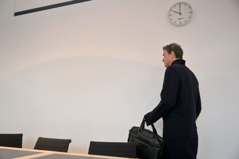 Former Germany and Arsenal goalkeeper Jens Lehmann, accused of trespassing and property damage is seen at Starnberg District Court. Lehmann has been fined by a court in his home town of Starnberg after he attacked a neighbour's garage with a chainsaw. Peter Kneffel/dpa