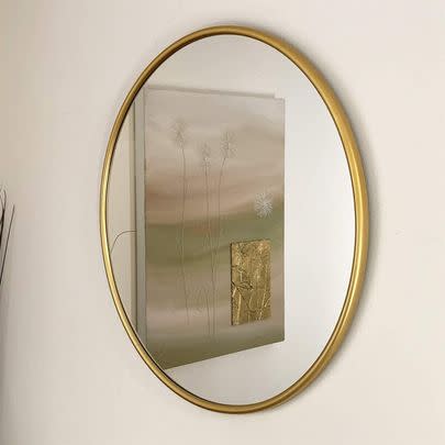 This sleek circular mirror