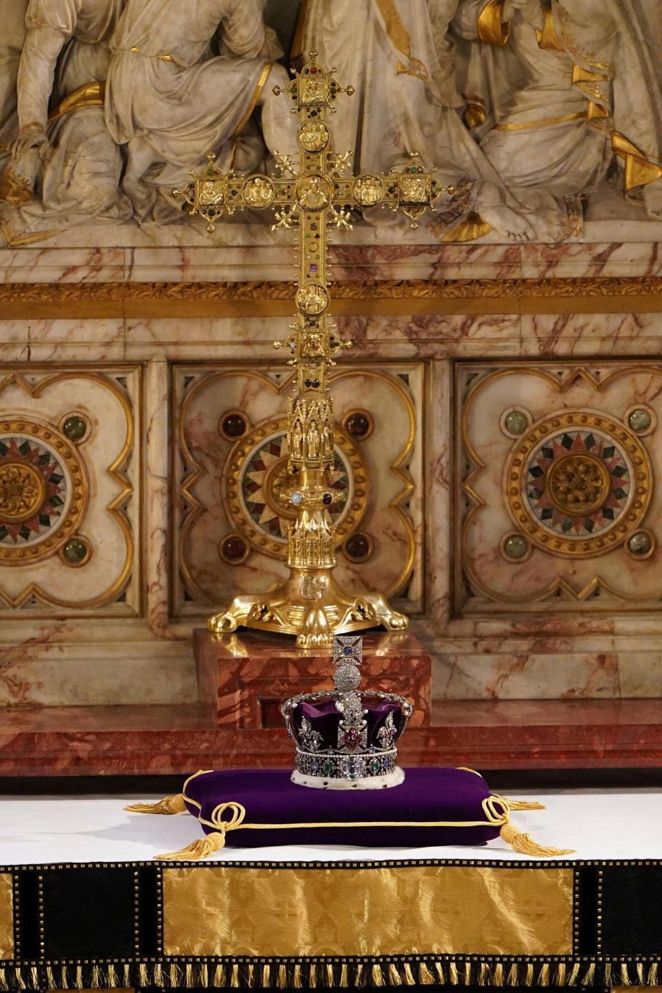 The Imperial State Crown rests on the high altar after being removed from the coffin of Queen Elizabeth II during a committal service at St. George's Chapel.