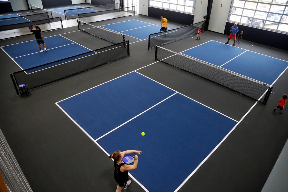 Guests play pickleball at Smash Park.