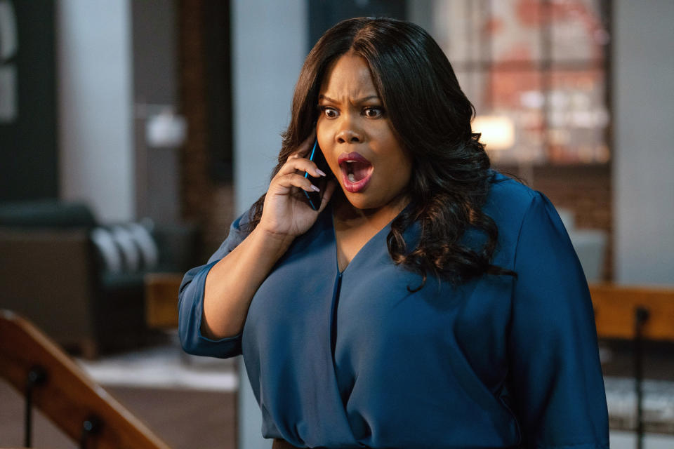 Amber Riley talking on the phone with a shocked expression on her face in "Nobody's Fool"