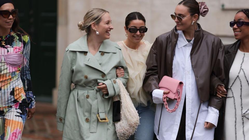 a group of women at copenhagen fashion week illustrating a guide to fall outfit ideas