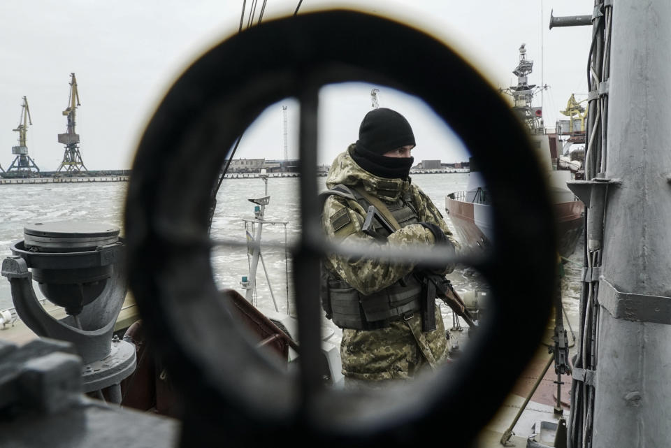 A Ukrainian serviceman stands on board a coast guard ship in the Sea of Azov port of Mariupol, eastern Ukraine, Monday, Dec. 3, 2018. The Ukrainian military has been on increased readiness as part of martial law introduced in the country in the wake of the Nov. 25, 2018 incident in the Sea of Azov, in which the Russian coast guard fired upon and seized three Ukrainian navy vessels along with their crews. (AP Photo/Evgeniy Maloletka)