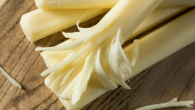 Partially peeled string cheese