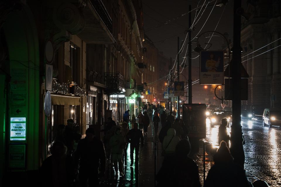 The lighting on the streets of Lviv last night was minimal, mostly coming from public transport and car headlights (Getty)