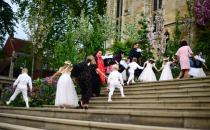 <p>The young bridesmaids and page boys enter together, holding hands. Their outfits were also designed by Luisa Beccaria. </p>