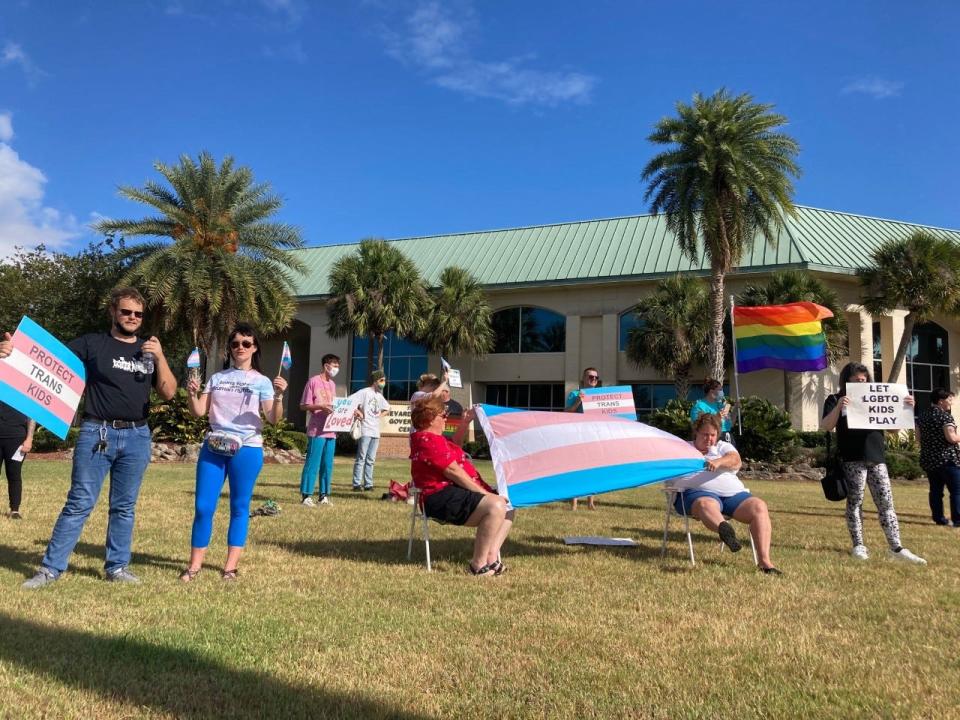 A small rally in Viera formed to protest a new Florida law regulating kids from participating in sports programs that fit with their gender identity.