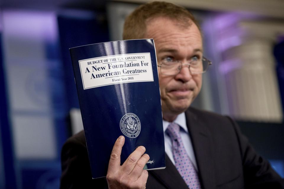 Budget Director Mick Mulvaney holds up a copy of President Trump's proposed fiscal 2018 federal budget