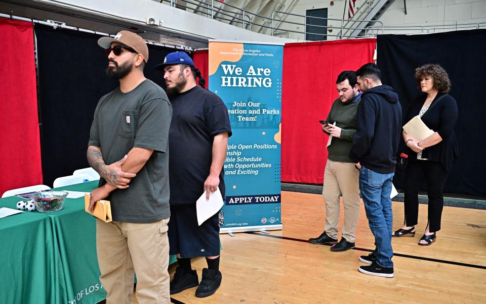 People wait in line for a chance to speak with prospective employers during a City of Los Angeles career fair offering to fill vacancies in more than 30 classifications of jobs on November 2, 2023 in Los Angeles, California. The US Bureau of Labour Statistics will release on November 3 the October jobs report amid expectations employment remains quite healthy. (Photo by Frederic J. BROWN / AFP) (Photo by FREDERIC J. BROWN/AFP via Getty Images)