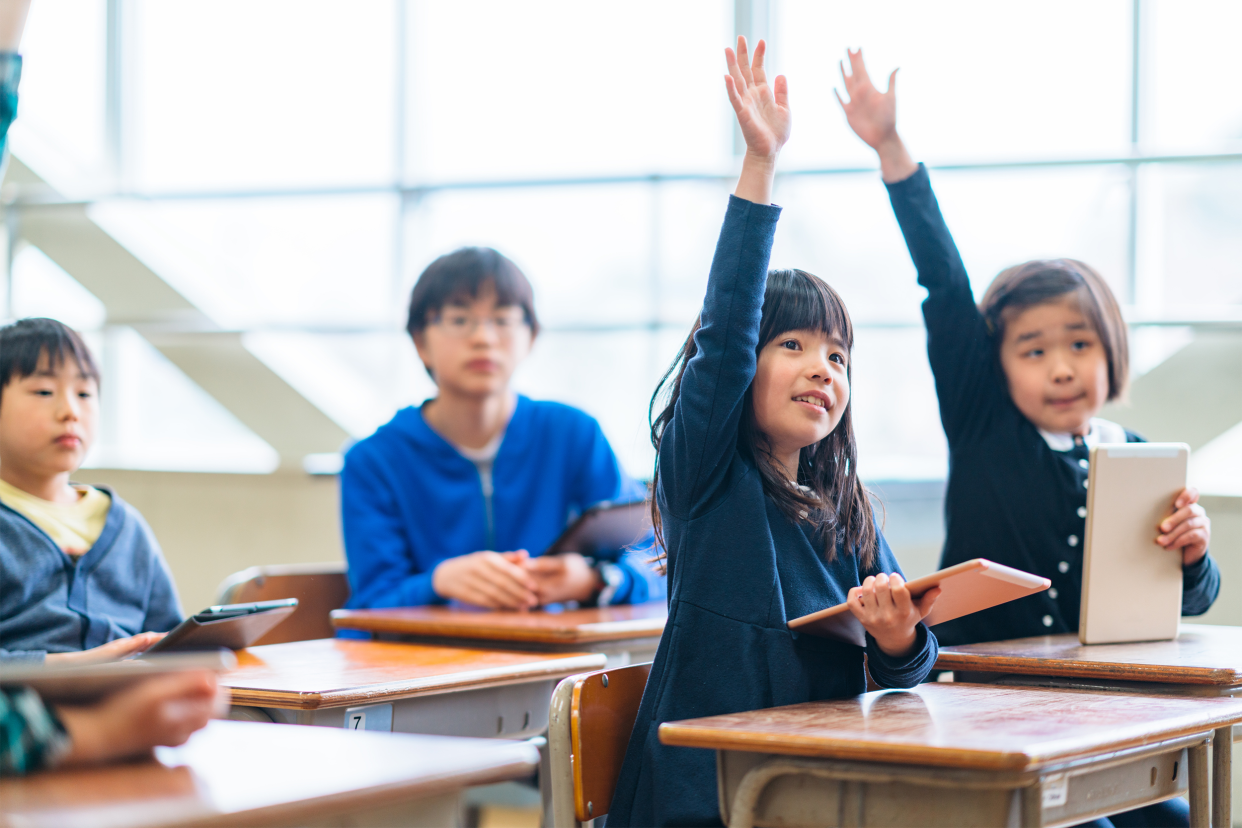 Elementary school students studying in classroom