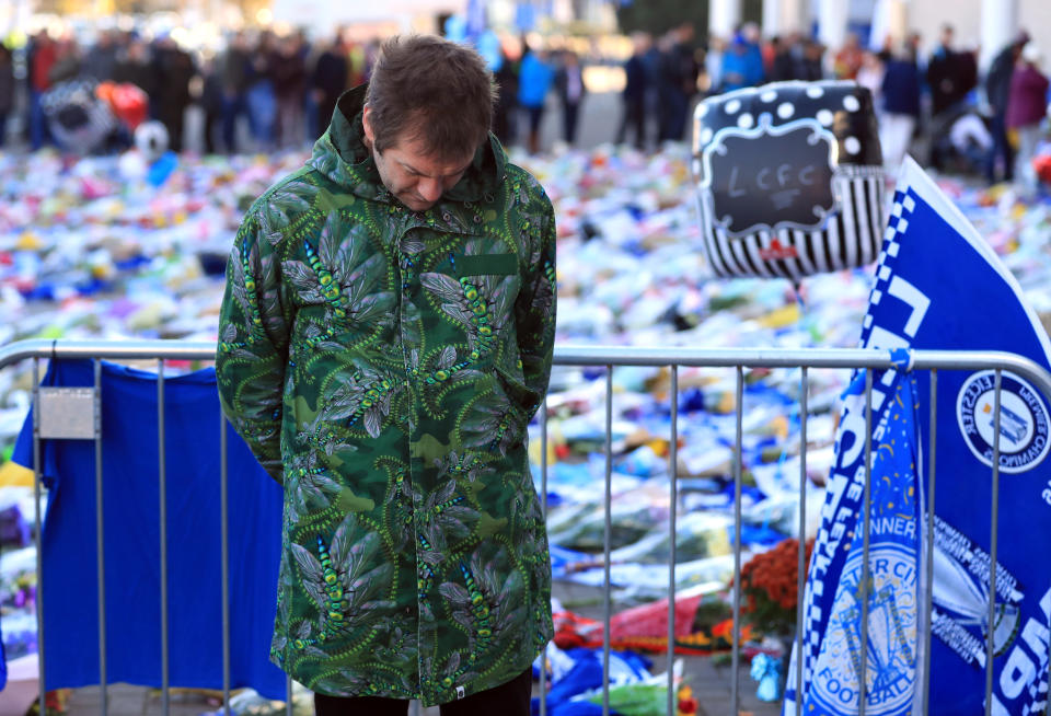<p>Kasabian singer Tom Meighan pays tribute outside the King Power Stadium. Mike Egerton/PA Wire </p>