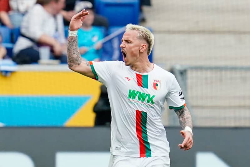 Augsburg's scorer Phillip Tietz celebrates scoring his side's second goal during the German Bundesliga soccer match between TSG 1899 Hoffenheim and FC Augsburg at the PreZero Arena. Uwe Anspach/dpa