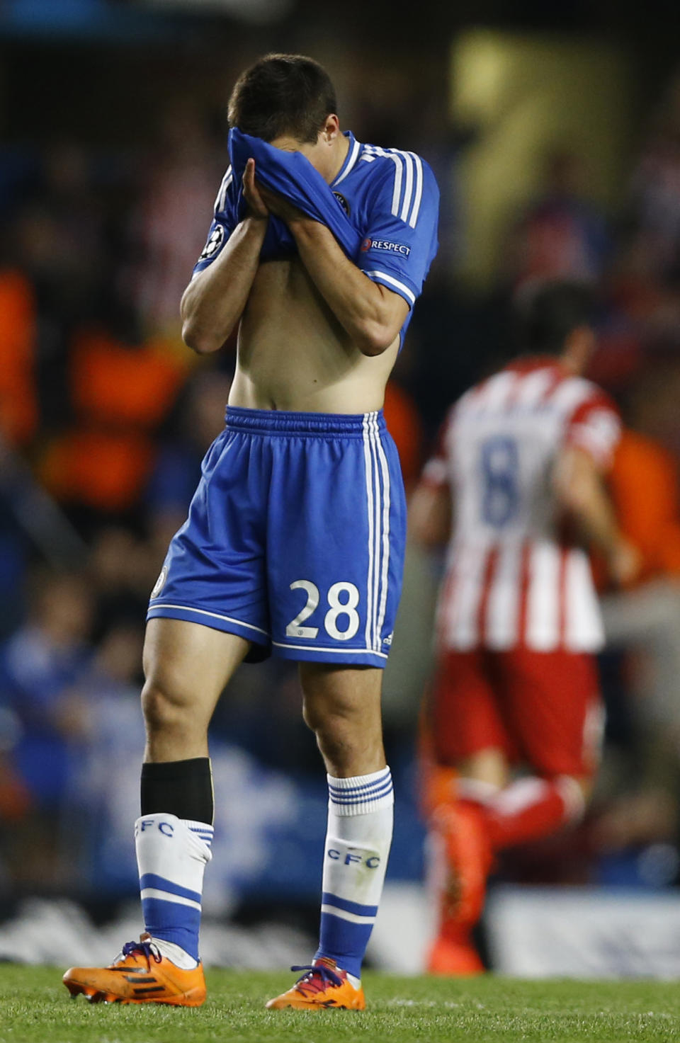 Chelsea's Cesar Azpilicueta, left, reacts at the end of the Champions League semifinal second leg soccer match between Chelsea and Atletico Madrid at Stamford Bridge Stadium in London Wednesday, April 30, 2014. (AP Photo/Kirsty Wigglesworth)