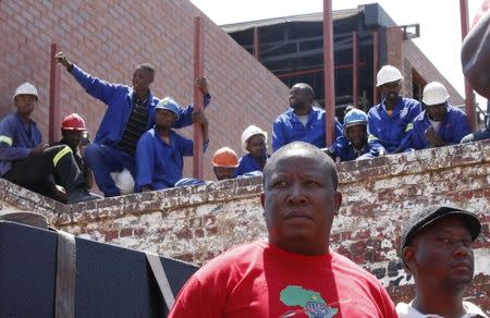 Economic Freedom Fighters (EFF) leader Julius Malema (C) waits to address supporters before a march to South Africa's constitutional court in Johannesburg, February 9, 2016. REUTERS/Sydney Seshibedi