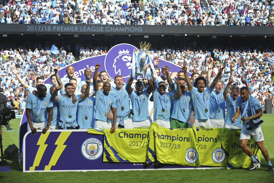 Manchester City players lift the English Premier League trophy on 6 May, 2018. (PHOTO: AP/Rui Vieira)