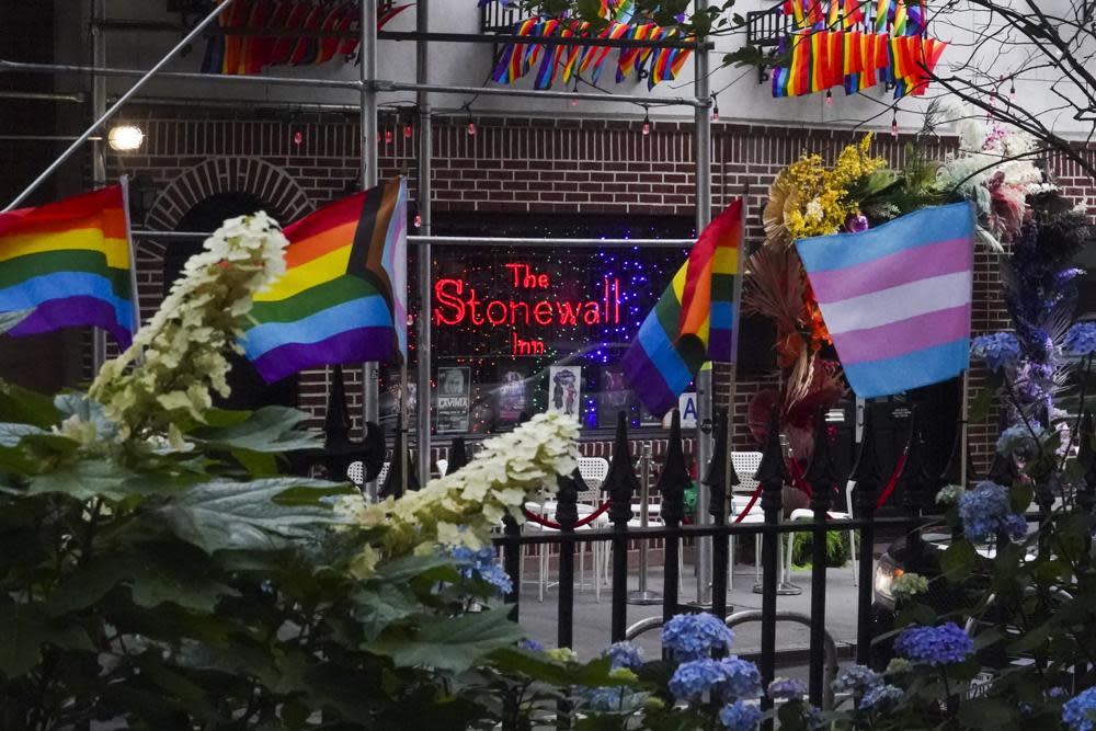 Flags affirming LGBTQ identity dress the fencing surrounding the Stonewall National Monument, Wednesday, June 22, 2022, in New York. (AP Photo/Bebeto Matthews)