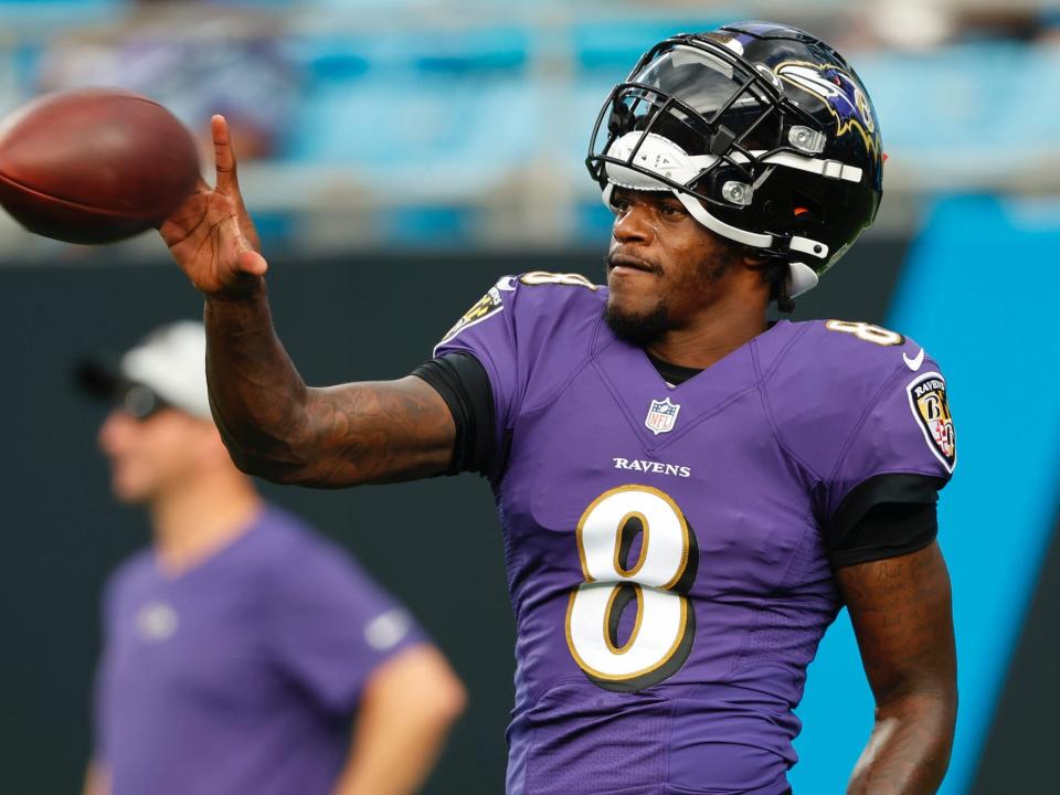 Lamar Jackson catches a pass during a preseason game in 2021.