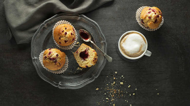 Jam-filled muffin with coffee mug