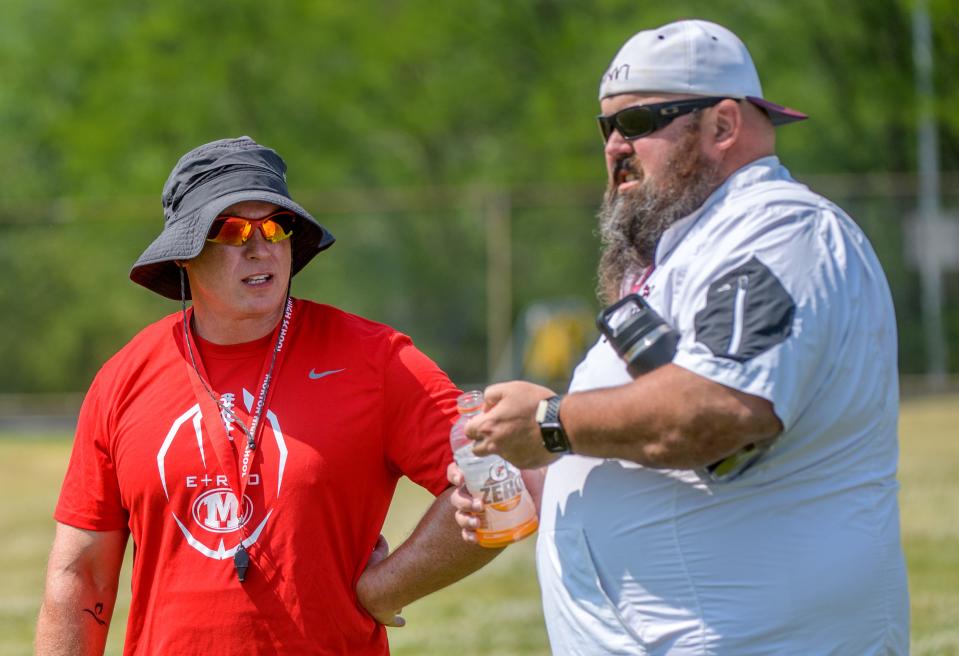 New Morton High School head football coach and former Peoria High assistant Adam O'Neill, left, talks with Peoria High head coach Tim Thornton during a combined practice Tuesday, June 20, 2023 at Peoria High School.