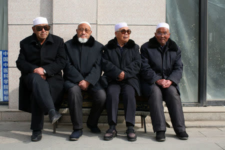 Men wait for afternoon prayers to begin at a mosque in China's Linxia, Gansu province, home to a large population of ethnic minority Hui Muslims, February 1, 2018. Picture taken February 1, 2018. REUTERS/Michael Martina