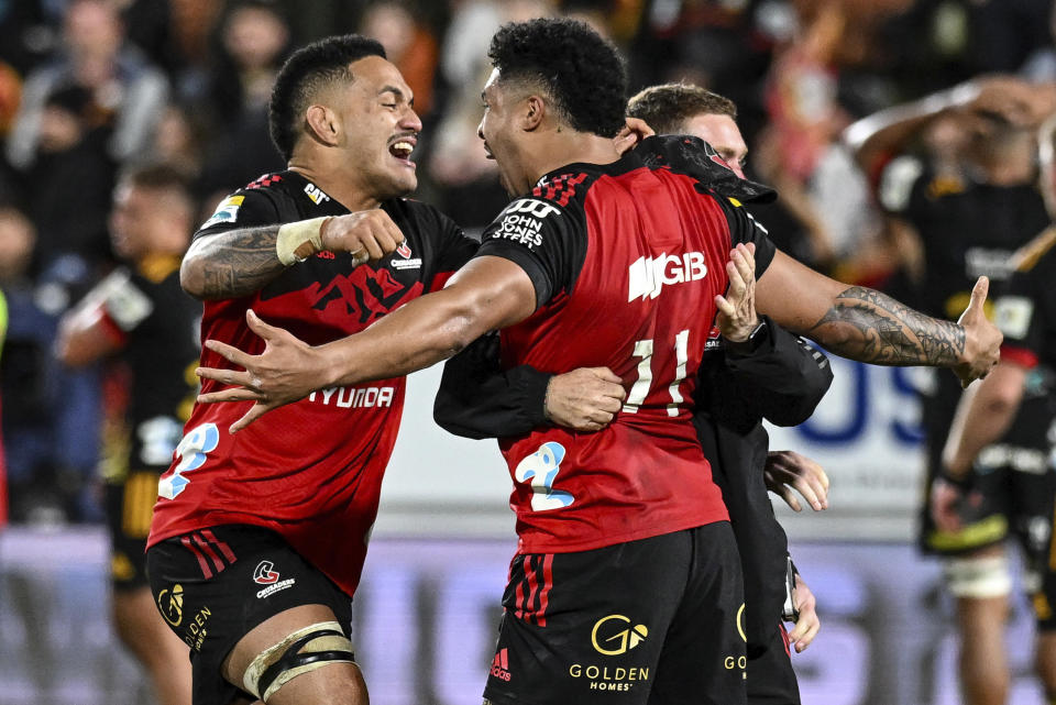 Crusader players celebrate after defeating the Chiefs in the Super Rugby Pacific final between the Chiefs and the Crusaders in Hamilton, New Zealand, Saturday, June 24, 2023. (Andrew Cornaga/Photosport via AP)