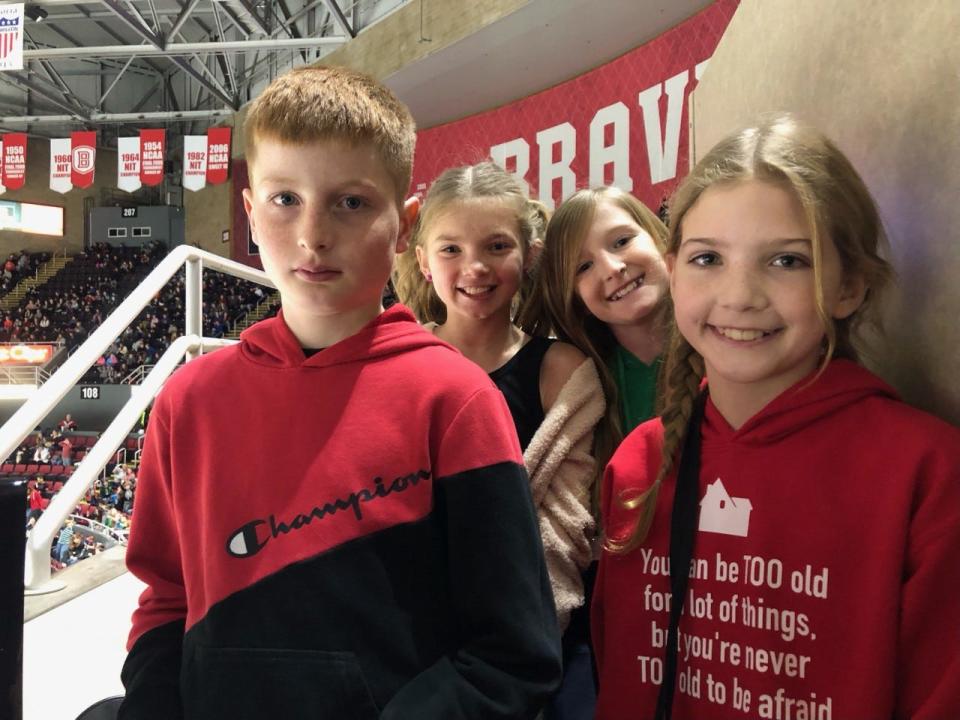 Norwood fifth-grade students Paul Dooley, Abby Blasek (front right), Morghan James (front right) and Simera Rickey (back left) were all enjoying their first Peoria Rivermen game as part of an Education Day morning game that drew 6,878 to Carver Arena on Thursday, Dec. 15, 2022.