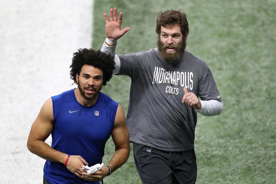 Indianapolis Colts tight end Kylen Granson (83) and Indianapolis Colts tight end Jack Doyle (84) leave the field before the game against the Las Vegas Raiders on Sunday, Jan. 2, 2022, at Lucas Oil Stadium in Indianapolis. 